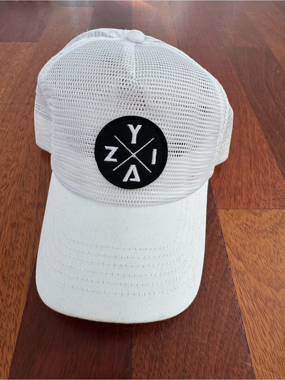 ZYIA White Mesh Trucker Hat with Black Logo Patch